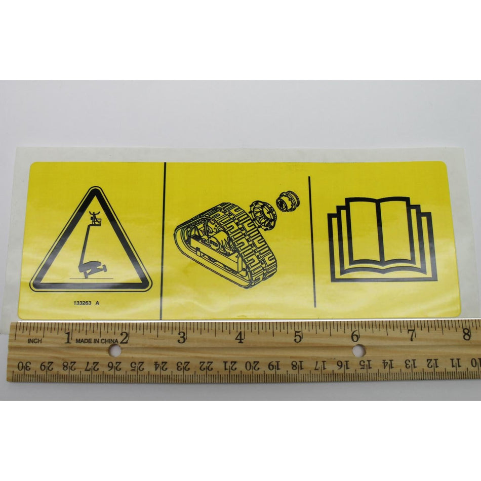 Genie Part # 133263. 133263GT - DECAL.LABEL.TIPOVER.TRAX.SYMB